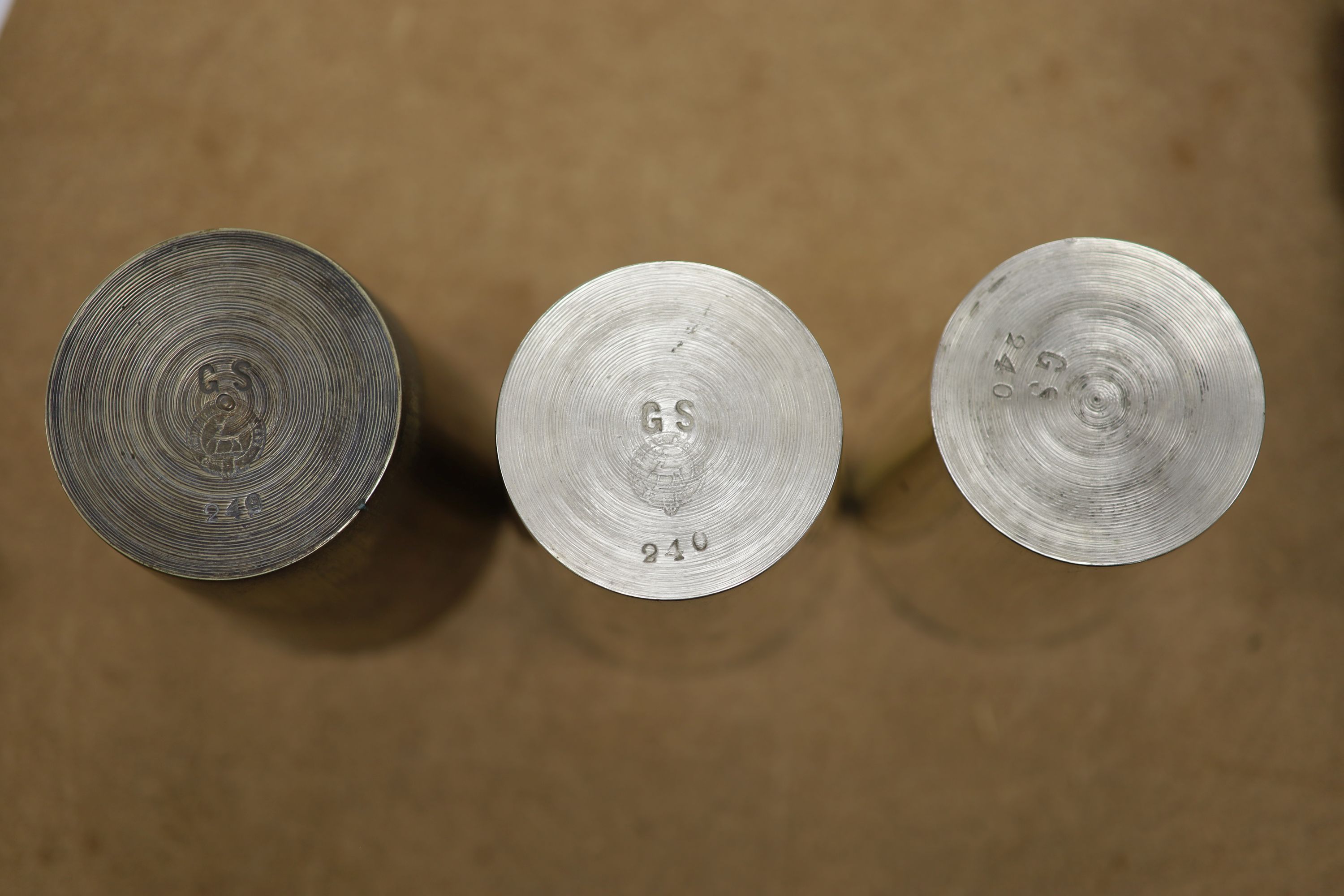 A leather cased flask and cups, various WWI and WWII medals, binoculars and a fishing reel